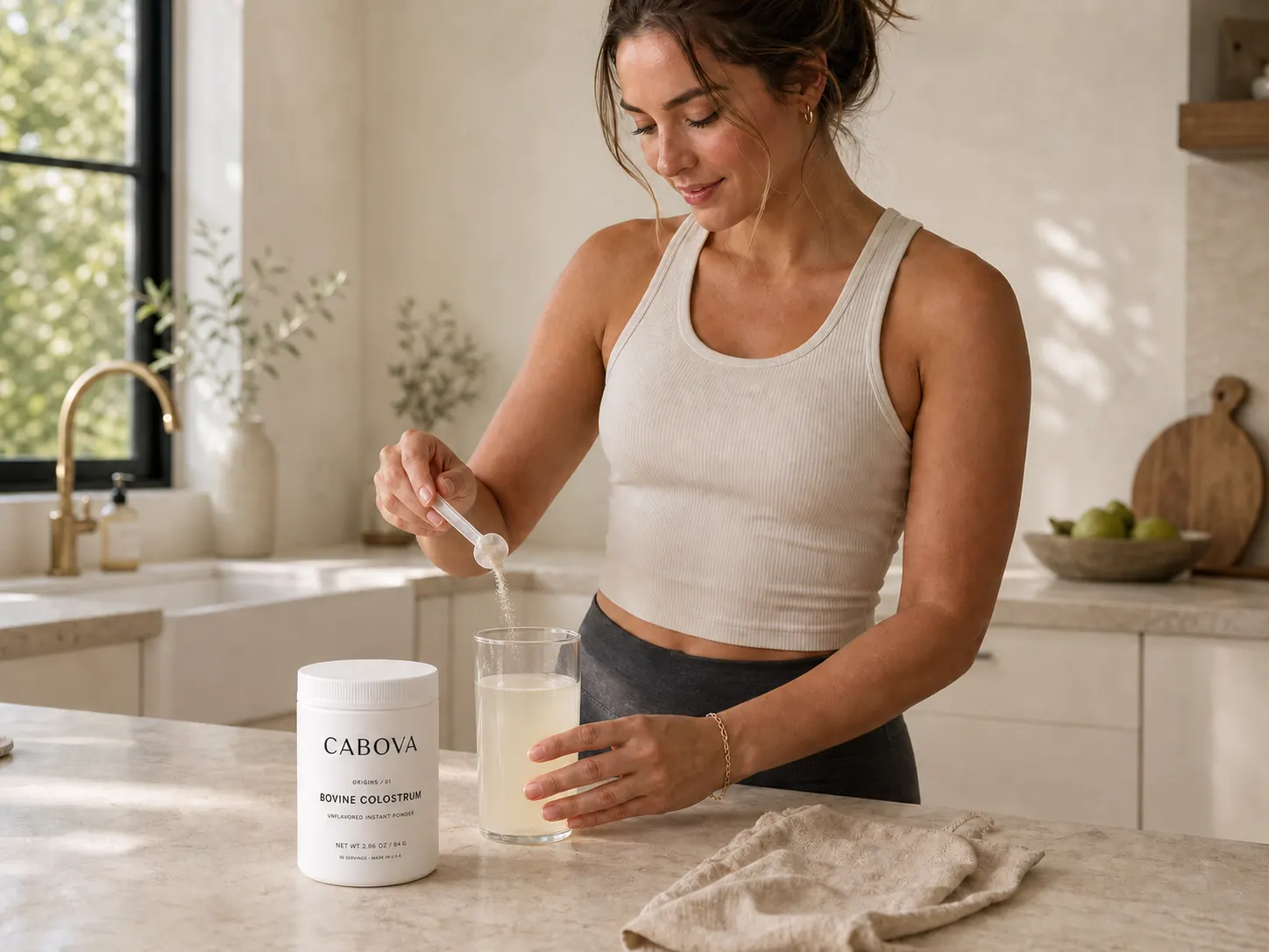 Woman mixing powder into a glass